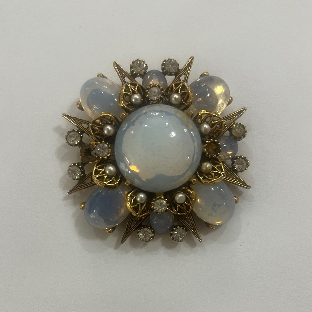 Elegant Gold and White Brooch